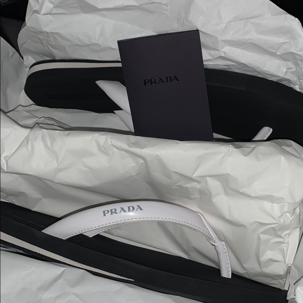 White Prada flip flops